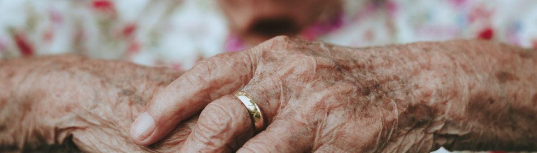 Aged hand with ring 